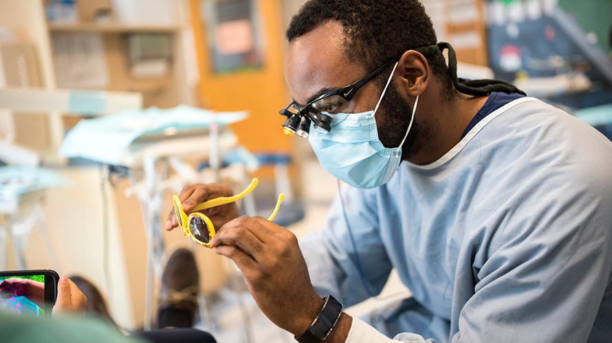 Dentist reviewing pediatric sunglasses