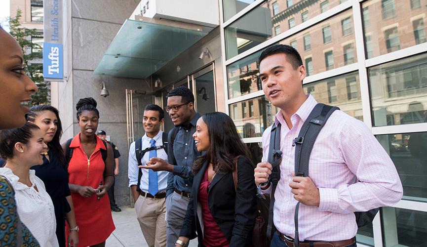 Students standing outside and chatting