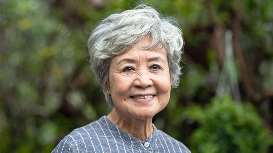 Smiling older woman outside