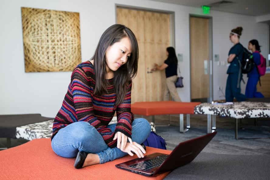 A student using a laptop