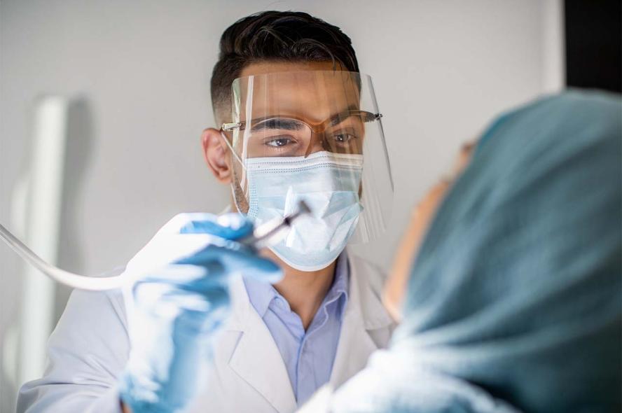 Face shields, adopted by dentists for COVID protection, also meet the new national eye-safety standards for health care workers. 