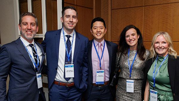 Alumni group with name tags smiling