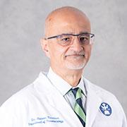 Nadeem Karimbux in white coat headshot photo
