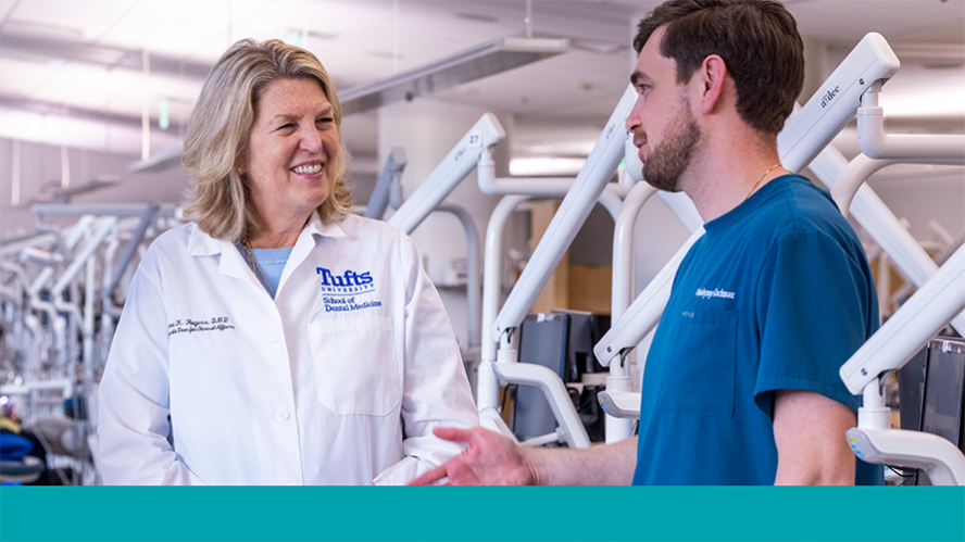 Dr. Dara Rogers talks to DMD student in Simulation Lab 