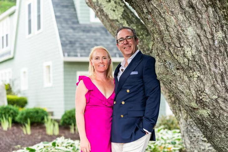 Anne Maka and Michael Dakin stand by tree